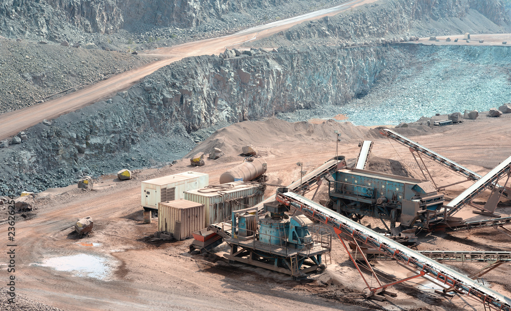 stone crusher in a quarry mine of porphyry rocks. stone crusher in a quarry mine of porphyry rocks.