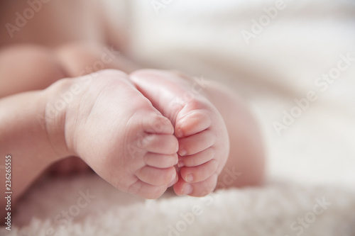 feet of baby on a light background