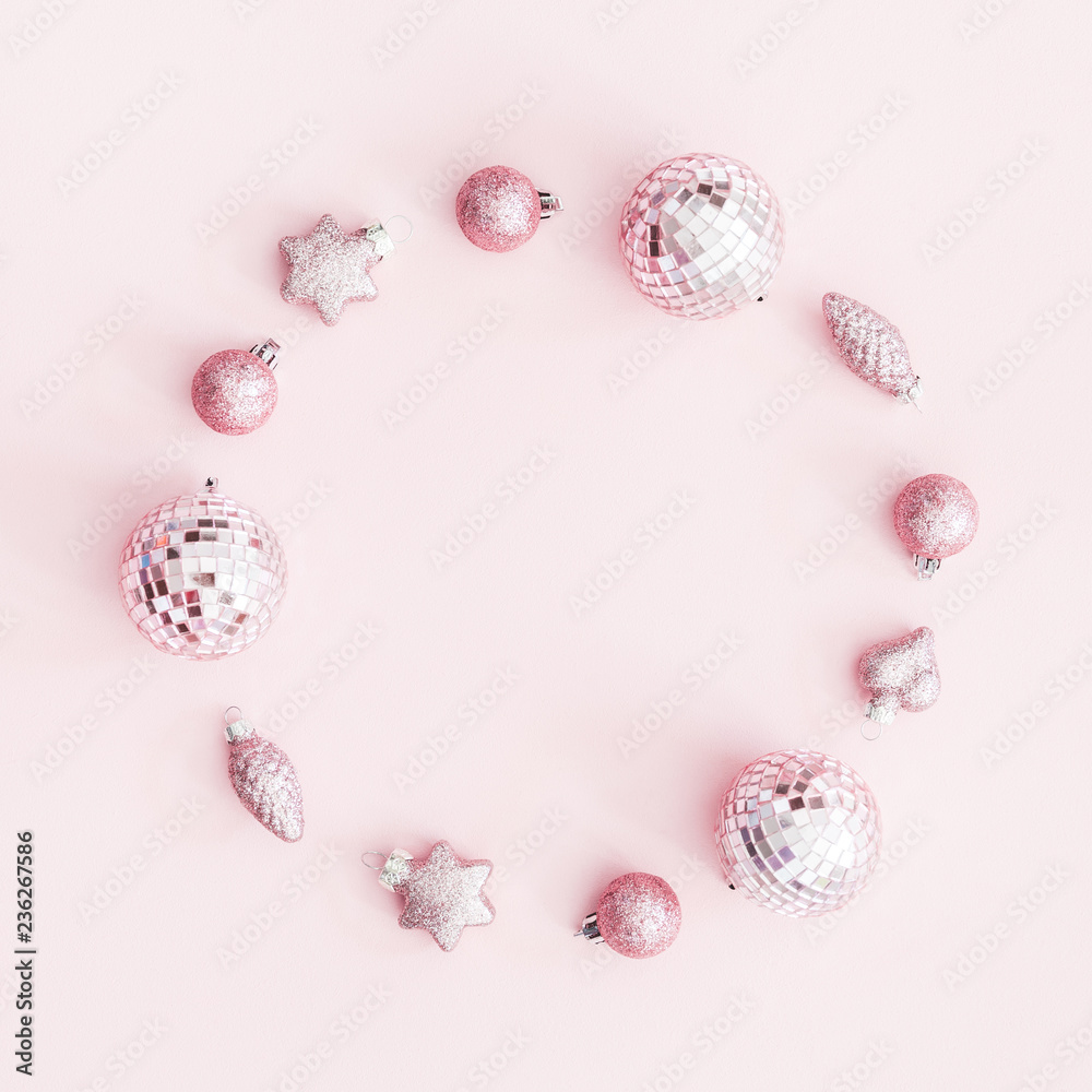 Christmas composition. Wreath made of pink balls on pastel pink background. Christmas, winter, new year concept. Flat lay, top view, copy space, square Christmas composition. Wreath made of pink balls on pastel pink background. Christmas, winter, new year concept. Flat lay, top view, copy space, square