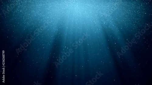 Abstract background with motion of shining blinking particles on blue background with rays of light.. VJ Seamless loop. photo