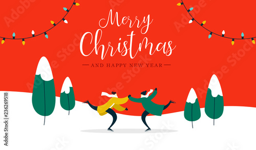 Christmas card young couple ice skating outdoors