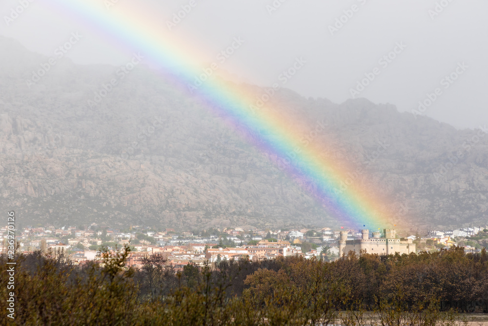 Arcoiris in the Santillana reservoir and the city of Manzanares el Real in Madrid Arcoiris in the Santillana reservoir and the city of Manzanares el Real in Madrid