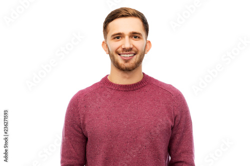people concept - smiling young man in pullover over white background © Syda Productions