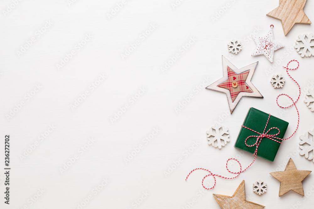 Christmas composition. Wooden decorations, stars on white background. Christmas, winter, new year concept. Flat lay, top view, copy space. Christmas composition. Wooden decorations, stars on white background. Christmas, winter, new year concept. Flat lay, top view, copy space.