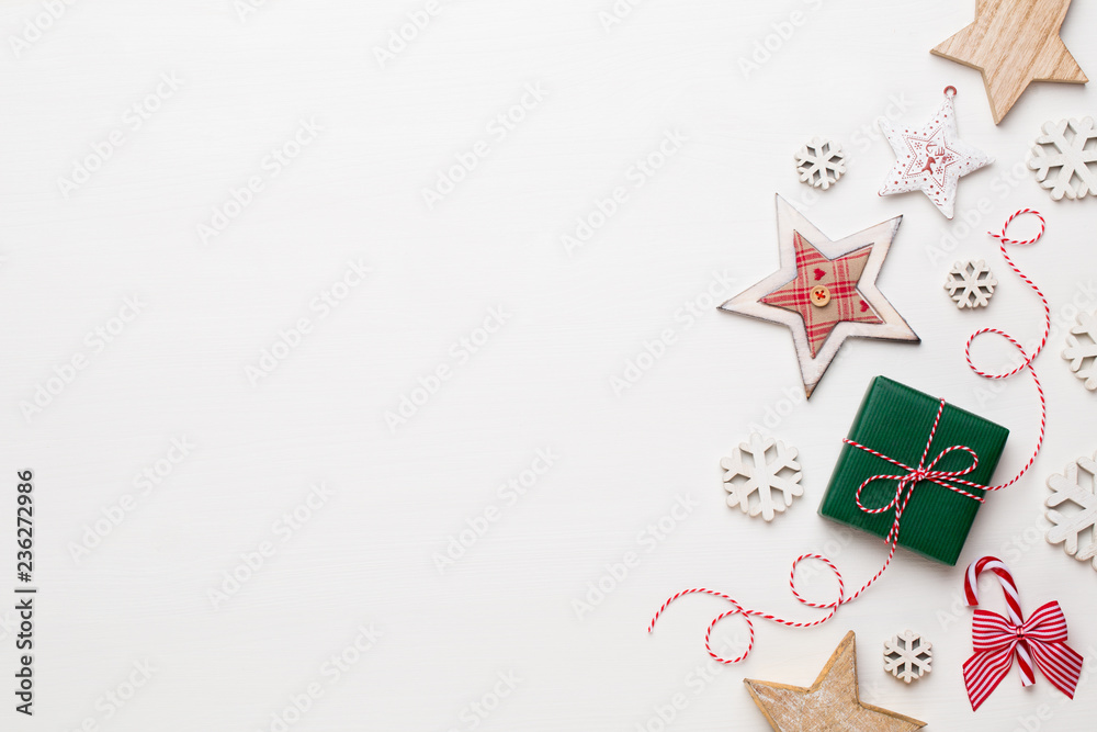 Christmas composition. Wooden decorations, stars on white background. Christmas, winter, new year concept. Flat lay, top view, copy space. Christmas composition. Wooden decorations, stars on white background. Christmas, winter, new year concept. Flat lay, top view, copy space.