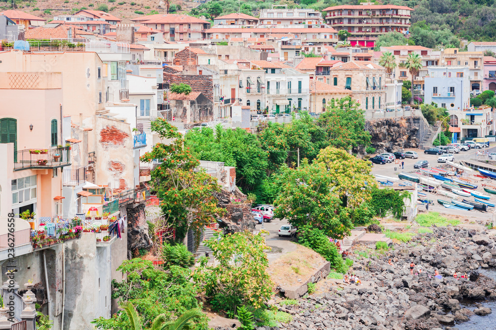 Cityscape of Acitrezza, view from the sea side of Acicastello, Catania, Sicily