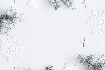 Christmas composition. Frame made of fir tree branches, decorations on pastel gray background. Christmas, winter, new year concept. Flat lay, top view, copy space