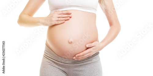 Close-up of pregnant woman touching her belly © Aleksandr Doodko