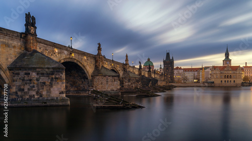 Morning view of Charles Bridge in Prague, Czech Republic. The Charles Bridge is one of the most visited sights in Prague. Architecture and landmark of Prague. Long exposure photo.
