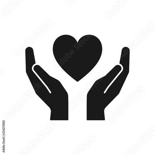 Black isolated icon of heart in hands on white background. Silhouette of heart and hands. Symbol of care, love, charity.