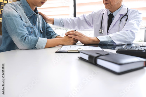 Doctor having support and comforting in conversation with patient and holding x-ray film while discussing explaining symptoms or counsel diagnosis health, healthcare and assistance concept