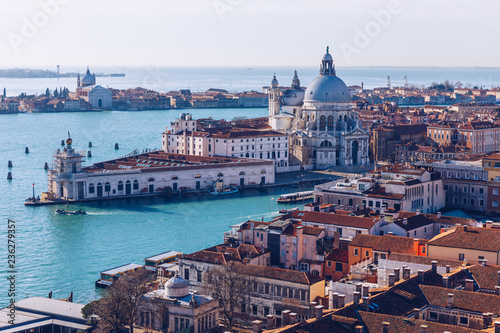 Venice panoramic aerial view with red roofs, Veneto, Italy. Aerial view of the Venice city, Italy. Venice is a popular tourist destination of Europe. Venice, Italy. © daliu