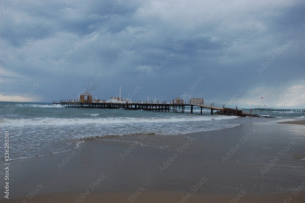 Pier on the beach during a storm