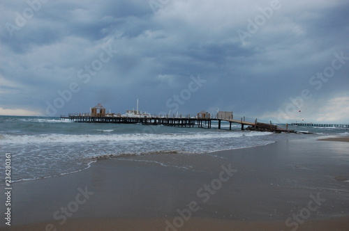 Pier on the beach during a storm