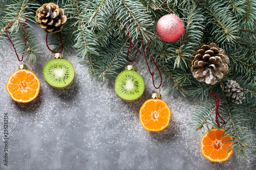 Christmas tree decorated with fruits of kiwi fruit and clementine. Healthy food and nutrition. Christmas decisions about a healthy lifestyle.
