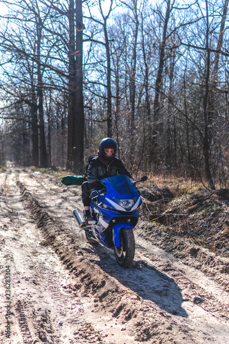 sport bike motorcycle on dirt road, off road, A bike driver, concept, active lifestyle, missed the turn, drove the wrong way, the navigator showed the wrong path, vertical photo