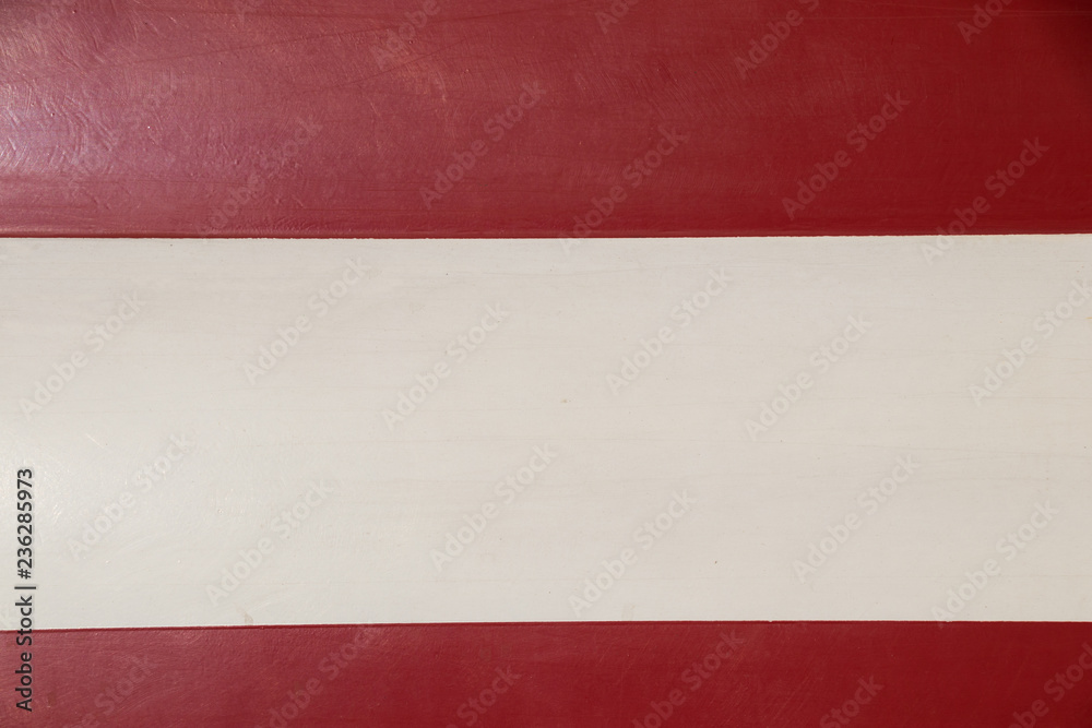Red and white painted part of fire truck Red and white painted part of fire truck