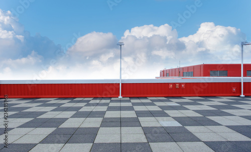 outdoor, modern red warehouse with blue sky