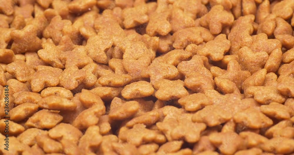 C4K closeup shot of the dry healthy dog or cat food on a turntable C4K closeup shot of the dry healthy dog or cat food on a turntable