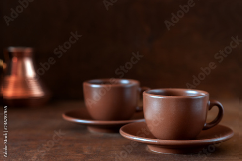 Coffee cups and copper Turk on the table