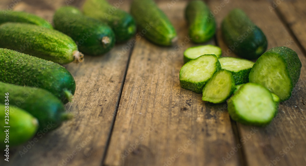 Fresh cucumbers on old wooden table Fresh cucumbers on old wooden table