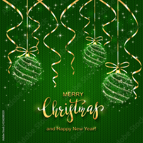Christmas Lettering on Green Knitted Background with Shining Balls