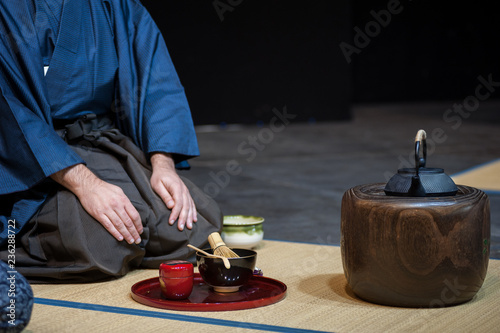 a man shows the tea ceremony during a public demonstration