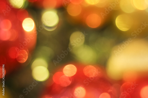 Defocused abstract christmas background. Red and yellow circle background © Oleksandra