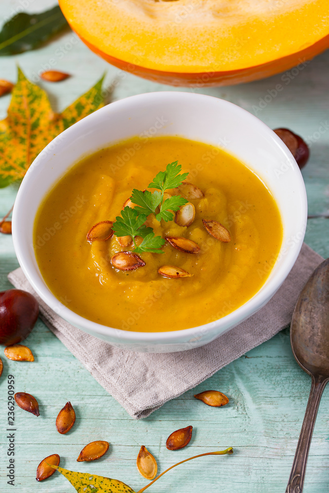 pumpkin soup on wooden surface pumpkin soup on wooden surface