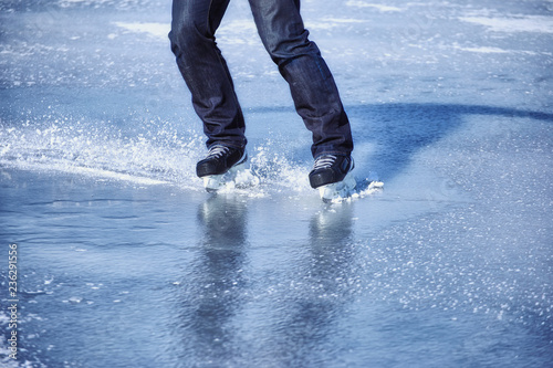 Winter sports ice skating on a sunny day.