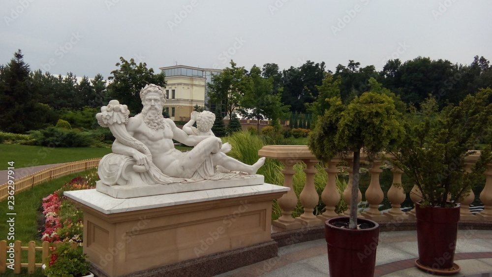 UKRAINE, MEZHYHIRYA - NOVEMBER 4, 2014. Marble statue of Zeus in the park Mezhyhirya