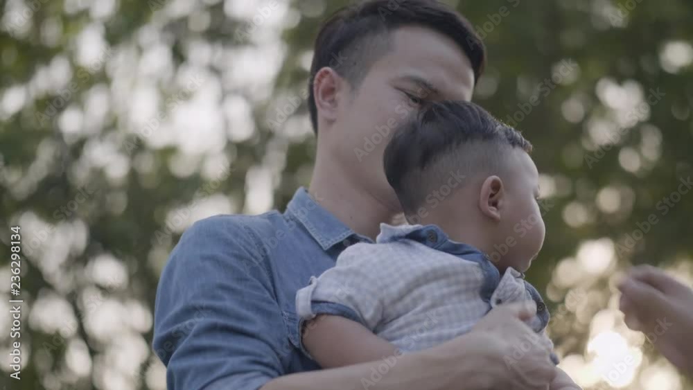 Asian mothers and fathers care for their son and tease in the garden. Asian mothers and fathers care for their son and tease in the garden.