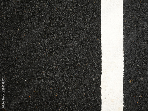 Black paved road background. © ruttanapol
