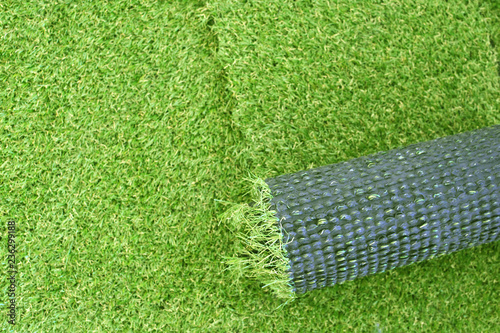 Artificial green grass laying background photo