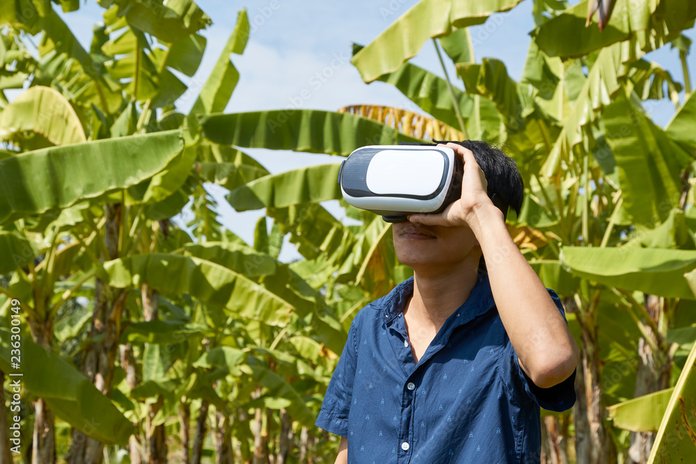 Asian man using the virtual reality headset Asian man using the virtual reality headset