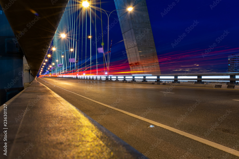 Long exposure traffic lights on the bridge, traffic in the city at night