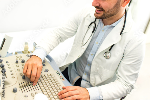 Male doctor with ultrasonic...