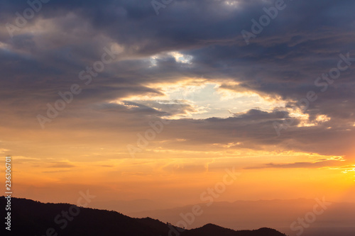 colorful dramatic sky with cloud at sunset.