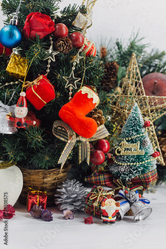 Christmas background with decorations and gift boxes on wooden