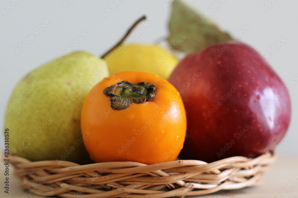 Ripe persimmon, apple, quince and pear Ripe persimmon, apple, quince and pear