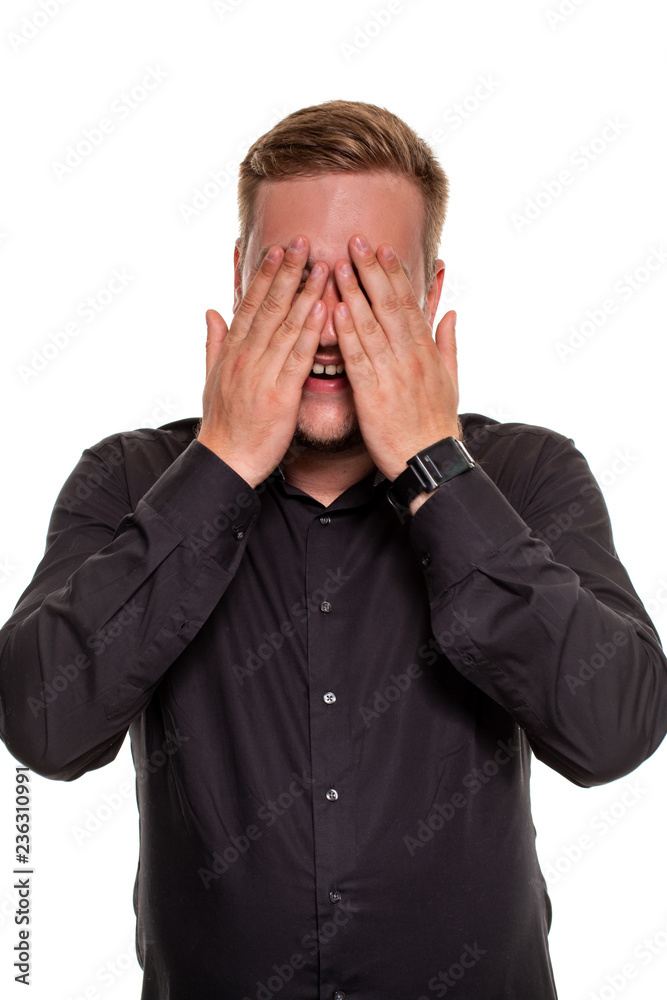 A man shows embarrassment, isolated on a white background A man shows embarrassment, isolated on a white background
