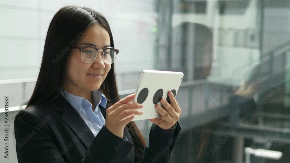 Young Asian Business Woman Using Digital Mobile Tablet Screen Browsing the Web Young Asian Business Woman Using Digital Mobile Tablet Screen Browsing the Web