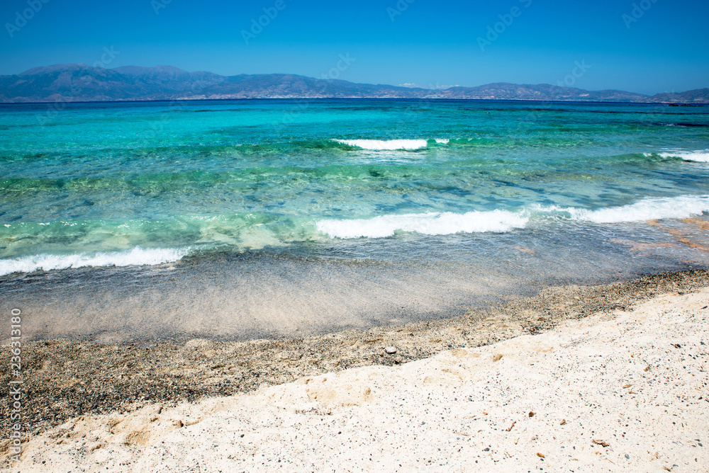 Beautiful beach with crystal clear sea and blue sky