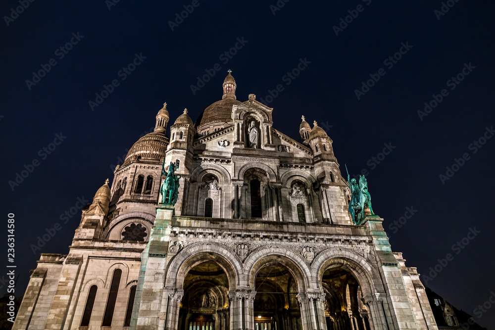 The Basilica of the Sacred Heart (Sacré-Coeur) by night in Paris, France