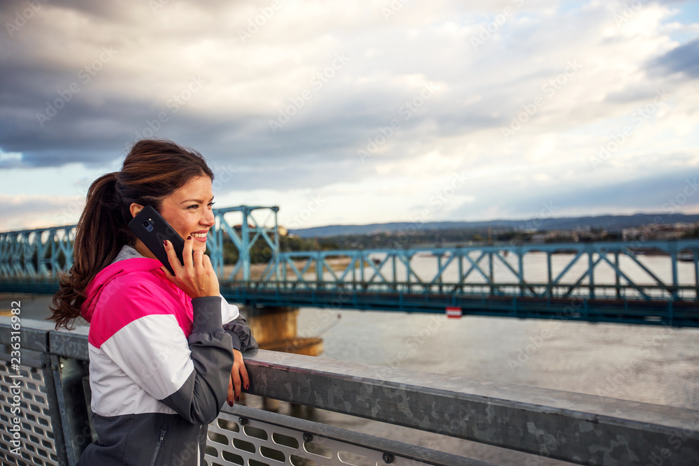 Female jogger talking on the phone