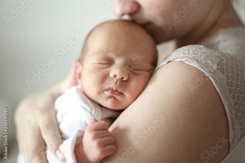 Fotografie, Obraz Mom and newborn baby. Light tone and soft toning