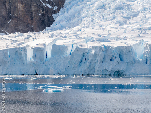 Deville glacier calving in Andvord Bay near Neko Harbor, Arctowski Peninsula, Antarctica photo