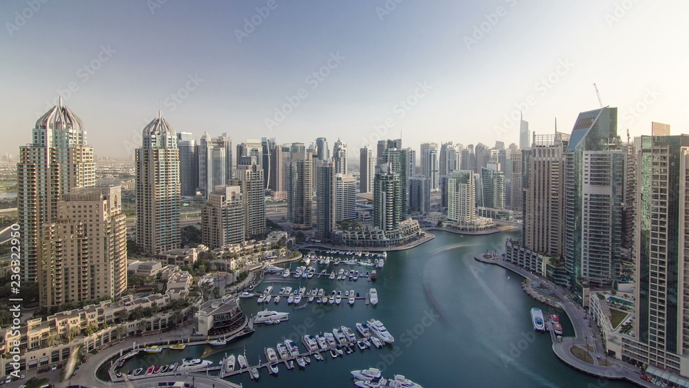 Modern buildings in Dubai Marina with shadows moving very fast timelapse, Dubai, UAE.