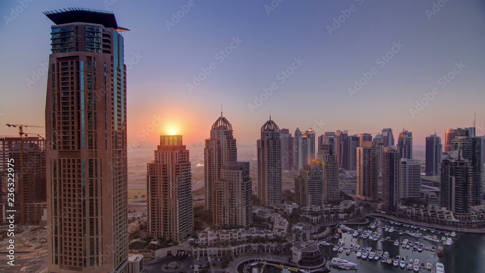 Sunrise in Dubai Marina with towers and harbor with yacht from skyscrapper, Dubai, UAE timelapse 4K