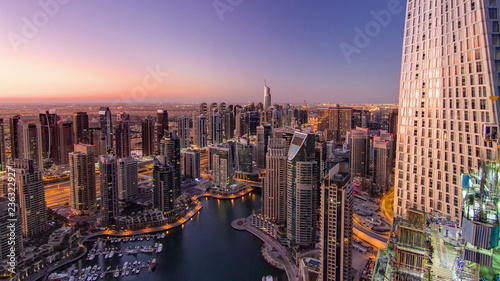 Dubai marina harbor from night to day transition timelapse